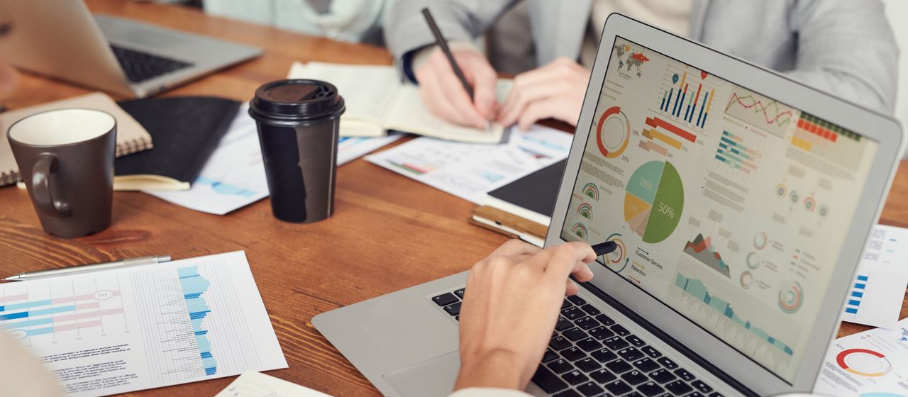 Reviewing compliance documents on a desk